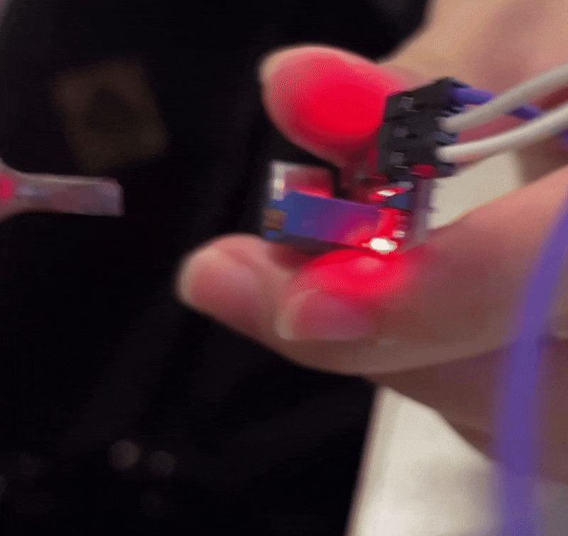 Manually twisting the physical threshold gauge of the Arduino microphone sensor with a screwdriver to increase its sensitivity.